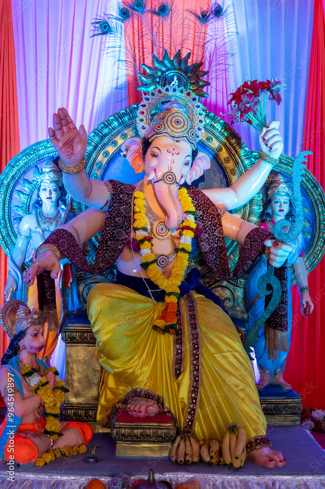 Fototapeta premium A Closeup shot Ganpati Installed in a Pandal during the 10 Day Ganesh Festival, the idols are immersed in heavy water bodies after the 10 days.