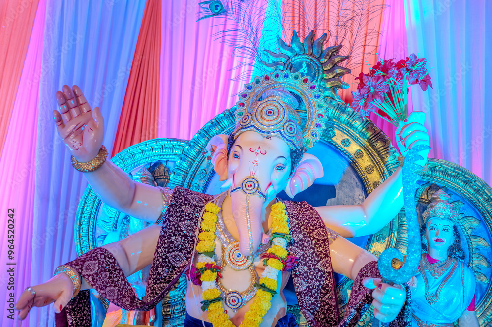 Fototapeta premium A Closeup shot Ganpati Installed in a Pandal during the 10 Day Ganesh Festival, the idols are immersed in heavy water bodies after the 10 days.