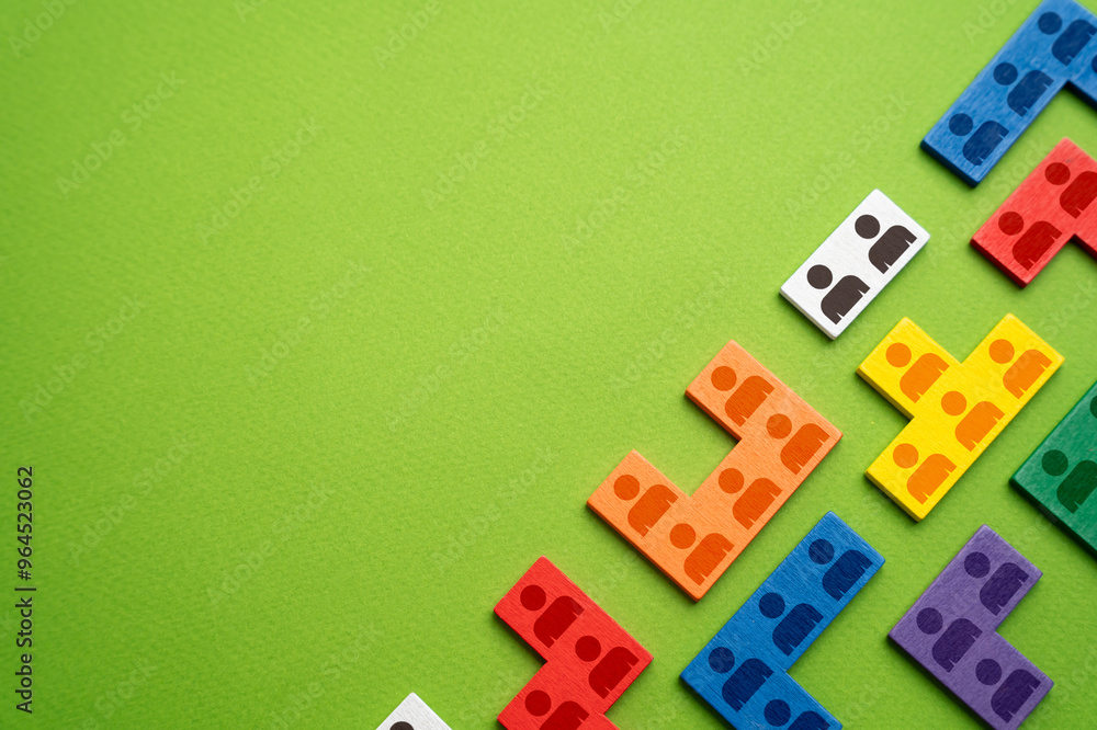 Obraz premium Puzzles with symbols of people. The concept of hiring employees and recruiting workers. Social groups of society. Human resource management. Marketing and market segmentation.