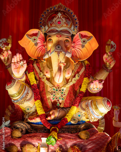 A Closeup shot Ganpati Installed in a Pandal during the 10 Day Ganesh Festival, the idols are immersed in heavy water bodies after the 10 days. photo