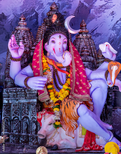 A Closeup shot Ganpati Installed in a Pandal during the 10 Day Ganesh Festival, the idols are immersed in heavy water bodies after the 10 days. photo