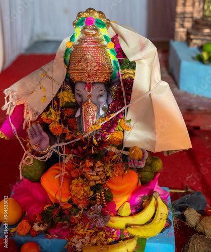 A Closeup shot Ganpati Installed in a Pandal during the 10 Day Ganesh Festival, the idols are immersed in heavy water bodies after the 10 days. photo