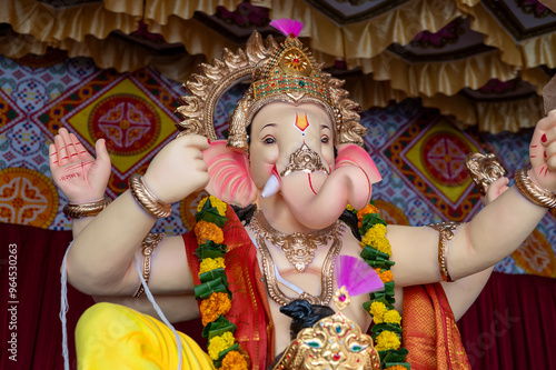 A Closeup shot Ganpati Installed in a Pandal during the 10 Day Ganesh Festival, the idols are immersed in heavy water bodies after the 10 days. photo