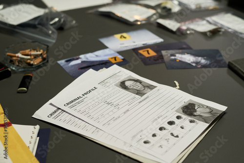 Canvastavla Various pieces of evidence and files spread on table during criminal investigation process