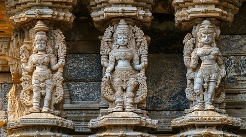 A close-up of the detailed carvings on the pillars of the Vittala Temple in Hampi.