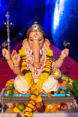 A Closeup shot Ganpati Installed in a Pandal during the 10 Day Ganesh Festival, the idols are immersed in heavy water bodies after the 10 days. photo