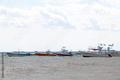 Boats yachts ship catamaran jetty beach Playa del Carmen Mexico.