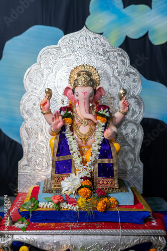 A Closeup shot Ganpati Installed in a Pandal during the 10 Day Ganesh Festival, the idols are immersed in heavy water bodies after the 10 days. photo