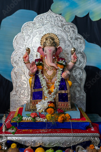 A Closeup shot Ganpati Installed in a Pandal during the 10 Day Ganesh Festival, the idols are immersed in heavy water bodies after the 10 days. photo