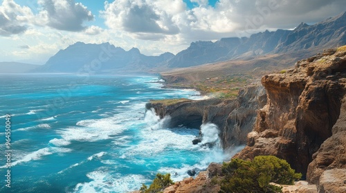 A panoramic view of the rugged coastline of Socotra Island, with waves crashing against the cliffs.