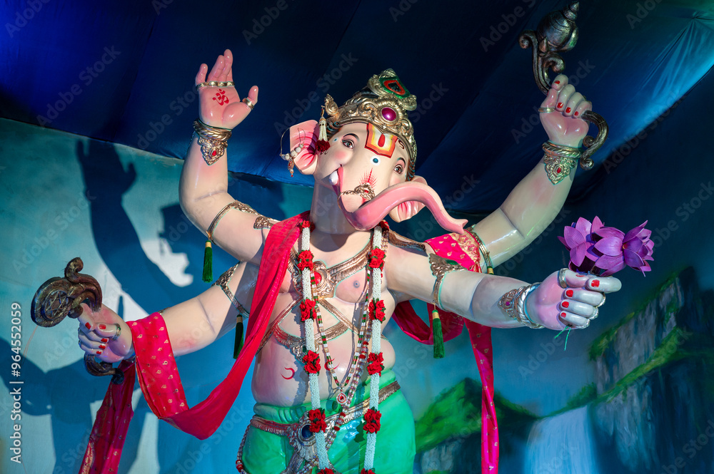 Fototapeta premium A Closeup shot Ganpati Installed in a Pandal during the 10 Day Ganesh Festival, the idols are immersed in heavy water bodies after the 10 days.