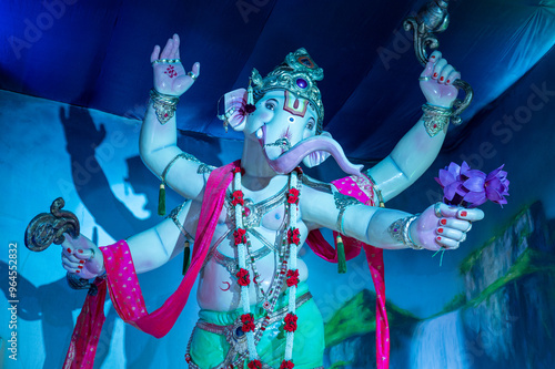 A Closeup shot Ganpati Installed in a Pandal during the 10 Day Ganesh Festival, the idols are immersed in heavy water bodies after the 10 days. photo