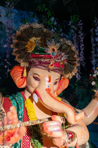 A Closeup shot Ganpati Installed in a Pandal during the 10 Day Ganesh Festival, the idols are immersed in heavy water bodies after the 10 days. photo