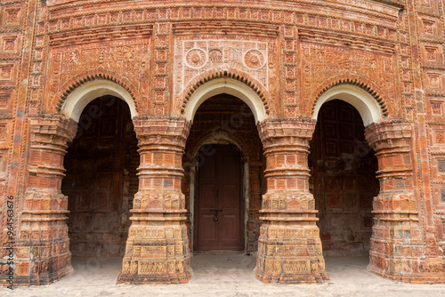 Entrance arch decorated with terracotta carvings in Pancha Ratna Govinda Temple, Rajshahi District, Puthia, Bangladesh photo