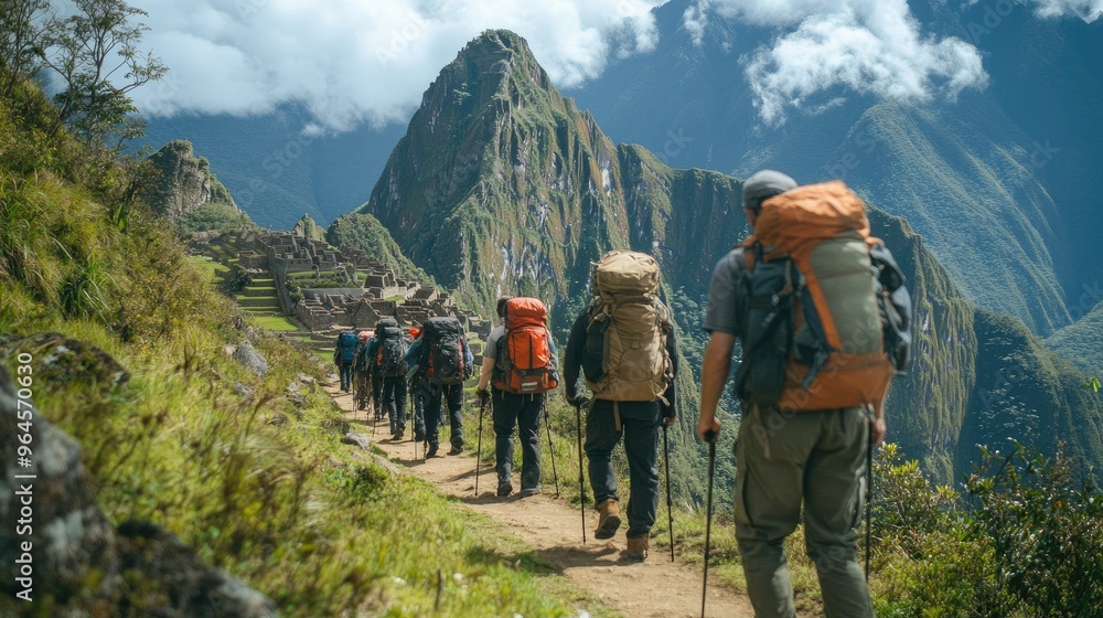 Obraz premium Machu Picchu as seen from the Inca Trail, with hikers approaching the ancient city.