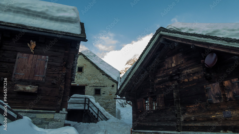 old chalets in alpe devero during winter old chalets in alpe devero during winter