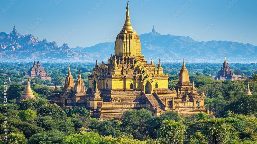 The golden spires of the Ananda Temple in Bagan, shining brightly under the midday sun. The golden spires of the Ananda Temple in Bagan, shining brightly under the midday sun.