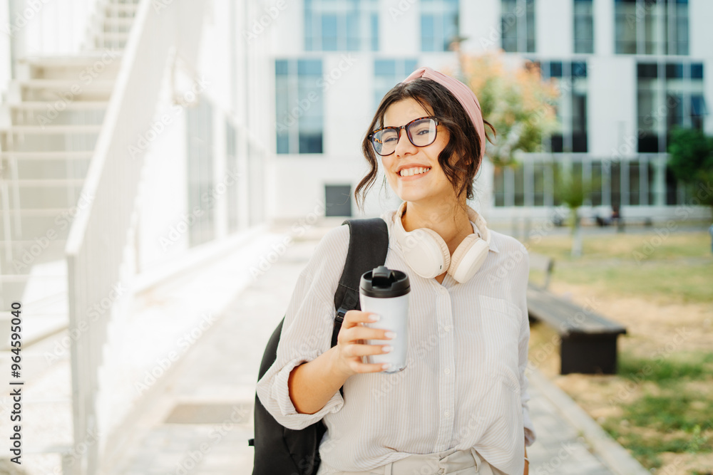 Fototapeta premium Young caucasian women student going to university at university campus 