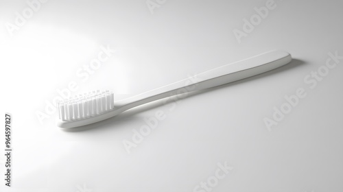 Simple Toothbrush: A plain, white toothbrush with a minimalist design, lying flat on a white background, with a soft shadow beneath it. 