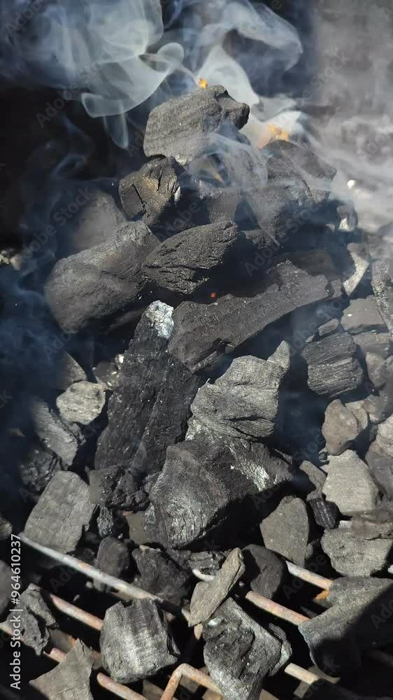 Charcoal burning in barbecue fire Charcoal burning in barbecue fire