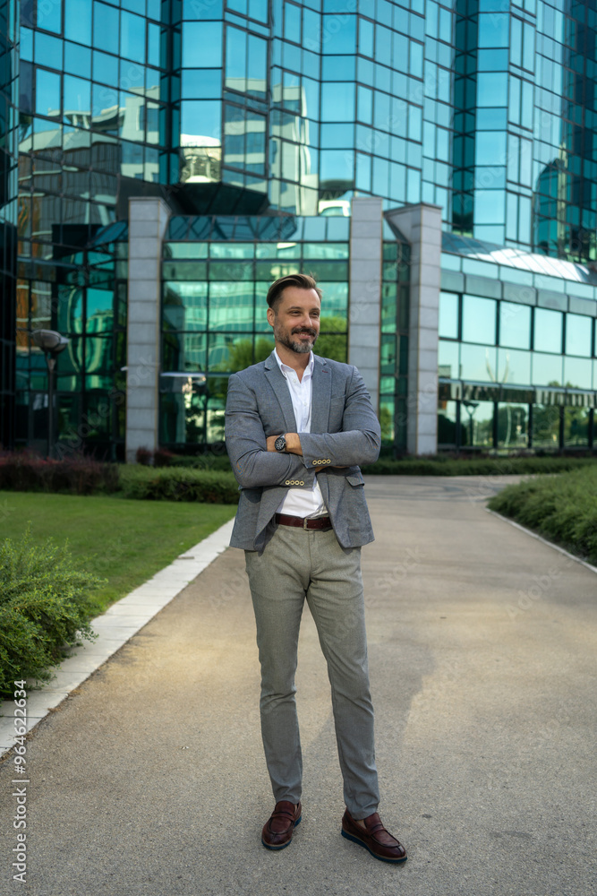 Business man standing with arms crossed, looking confident and proud in the city alone. Portrait of a white male entrepreneur or worker showing vision, ambition and success with arms folded downtown Business man standing with arms crossed, looking confident and proud in the city alone. Portrait of a white male entrepreneur or worker showing vision, ambition and success with arms folded downtown