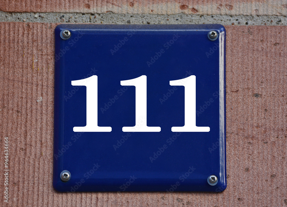 A blue house number plaque, showing the number hundred and eleven (111) A blue house number plaque, showing the number hundred and eleven (111)
