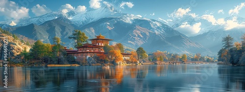 A majestic fortress overlooking the Punakha Valley, with snow-capped mountains in the background. photo