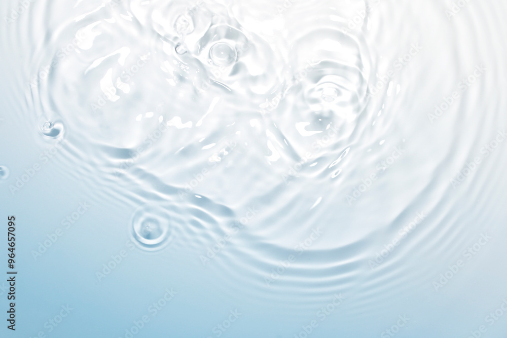 The clear blue surface of the water gradients from light to dark. The clear blue surface of the water gradients from light to dark.