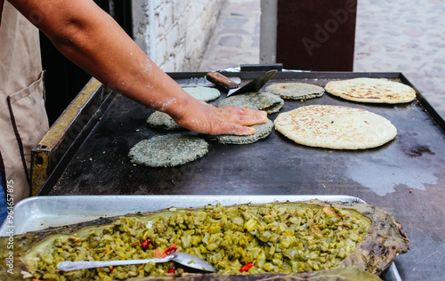 person preparing food, Traditional pre-Hispanic food from Mexico, Nopal en penca from Queretaro photo