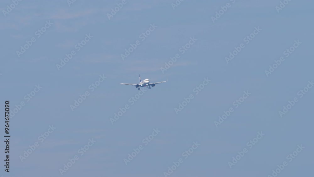 Passenger flight arriving. Jet commercial aircraft with an unrecognizable livery approaching landing, bottom view. Travel concept Passenger flight arriving. Jet commercial aircraft with an unrecognizable livery approaching landing, bottom view. Travel concept