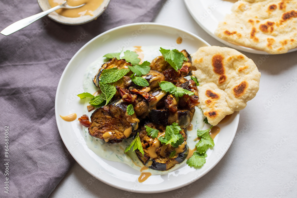 Roasted aubergines with dates, tahini and yogurt Roasted aubergines with dates, tahini and yogurt