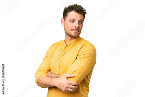 Brazilian man over isolated chroma key background looking to the side photo