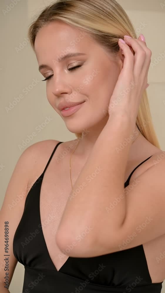 Bblonde girl with long hair looking at camera and smiling Bblonde girl with long hair looking at camera and smiling