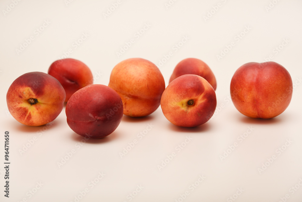 Juicy peaches on a white background. Ripe nectarines. Juicy peaches on a white background. Ripe nectarines.