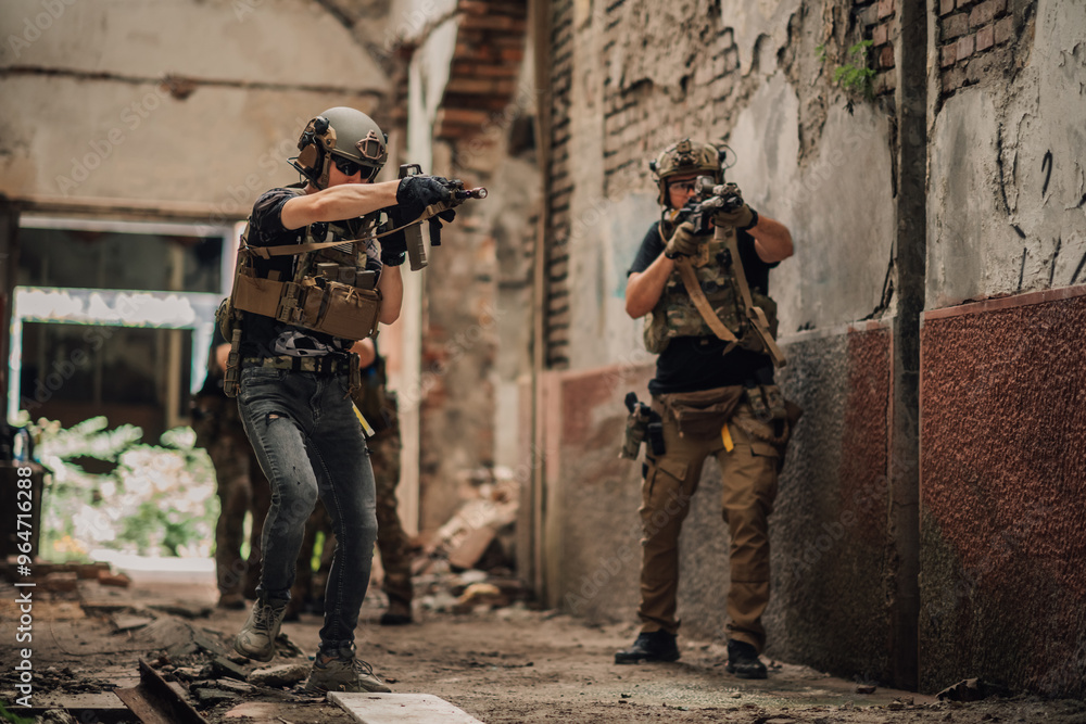 Group of air soft warriors shooting at opponent during action and mission Group of air soft warriors shooting at opponent during action and mission