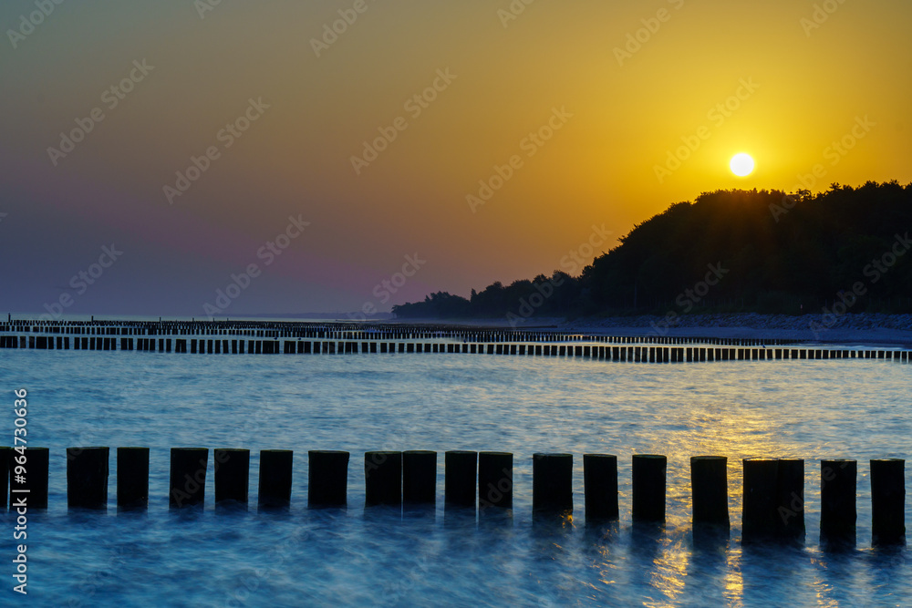 Fototapeta premium Golden sunrise over the Baltic Sea in Kolobrzeg