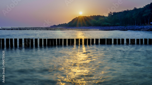 Fototapeta Naklejka Na Ścianę i Meble -  Golden sunrise over the Baltic Sea in Kolobrzeg