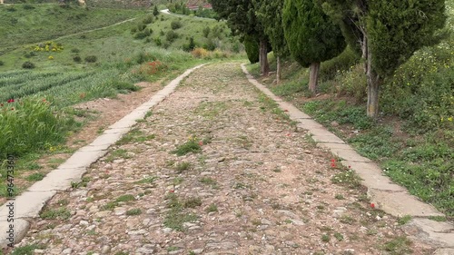 4K video of an old Roman Road leading away from the village of Cirauqui in Spain
