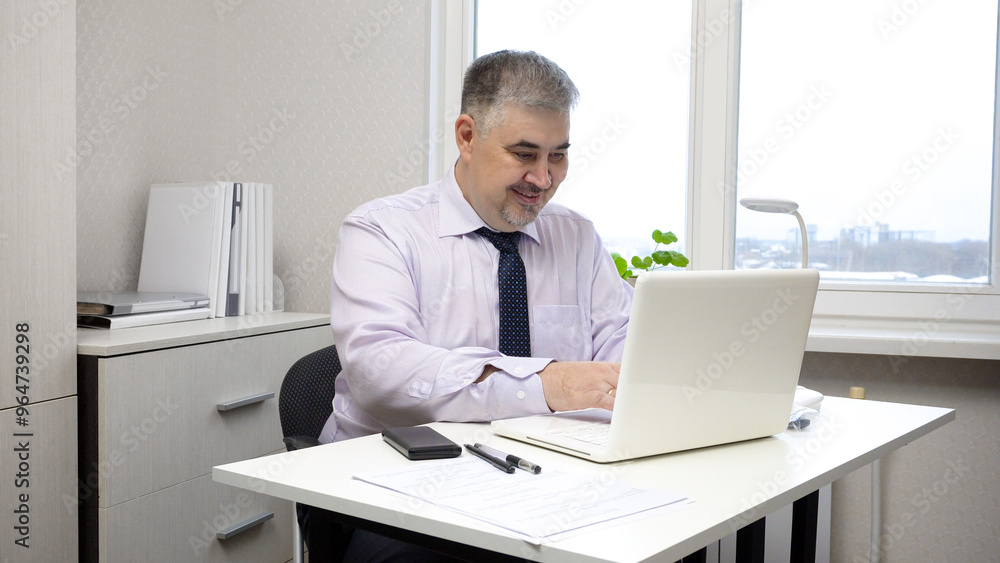 Businessman Working on Computer in Office Businessman Working on Computer in Office