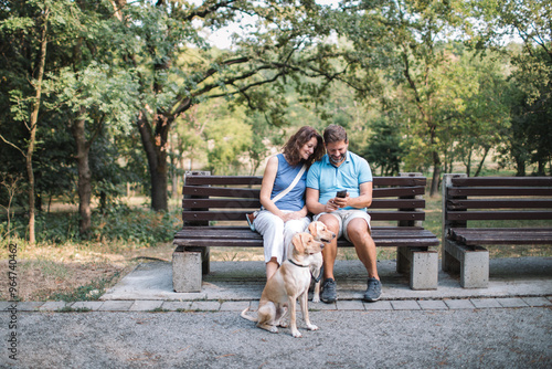 Sticker Couple relaxing on the bench with their dogs