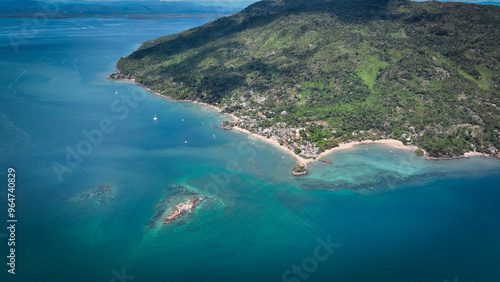 Aerial view of Nosy Komba Island in Madagascar showcasing its serene beaches and lush landscapes during a sunny day photo