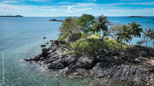 Aerial view of Nosy Komba Island in Madagascar showcasing rocky shoreline and lush greenery along the tranquil blue waters photo