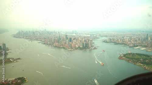 Aerial View of Lower Manhattan and New York Harbor. A Stunning Helicopter View of New York City's Iconic Skyline, Skyscrapers, and Busy Harbor Waters.