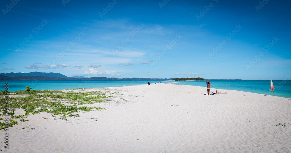 Obraz premium Discovering the serene beauty of Nosy Iranja Island in Madagascar on a sunny day at the beach with soft white sand and turquoise waters