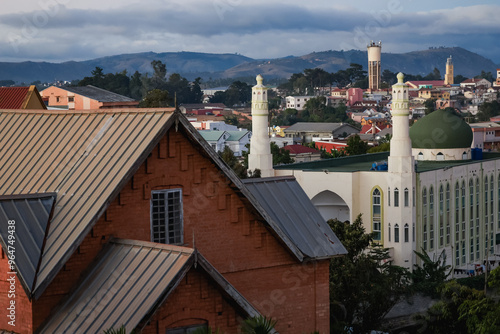 Authentic houses showcasing the architectural diversity of Antananarivo under a cloudy sky during late afternoon