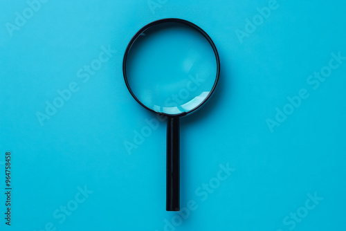 A magnifying glass is on a blue background. The blue background is a very calming color, and the magnifying glass is a symbol of curiosity and exploration