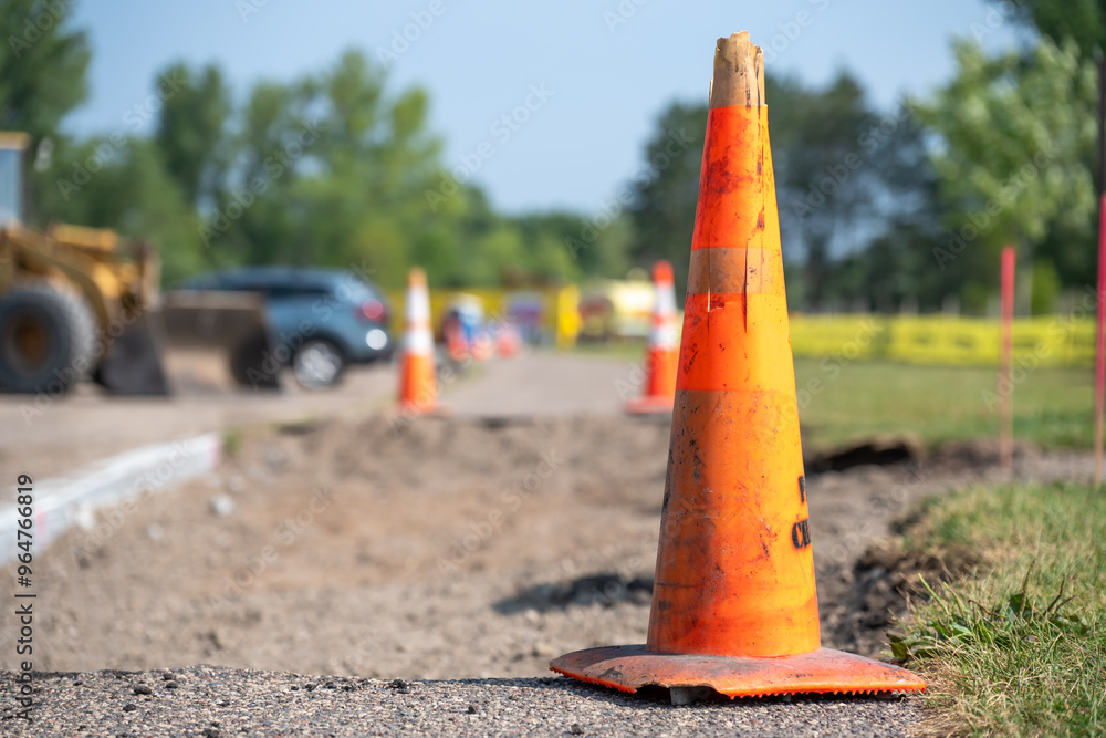 Road cone placed on a section of removed sidewalk during construction. Road cone placed on a section of removed sidewalk during construction.