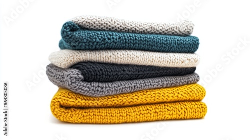 Stack pile of folded wooley knit cloth isolated on white background 