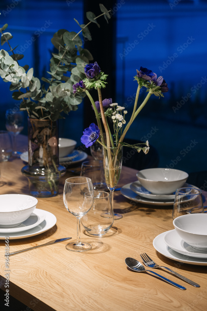 Fototapeta premium Table setting with flowers and white tableware