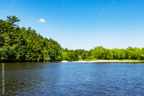 A fisherman fishes near one of many sandbars created from the sediment of the Cambrian Sandstone of the Wisconsin Dells along the Wisconsin River.